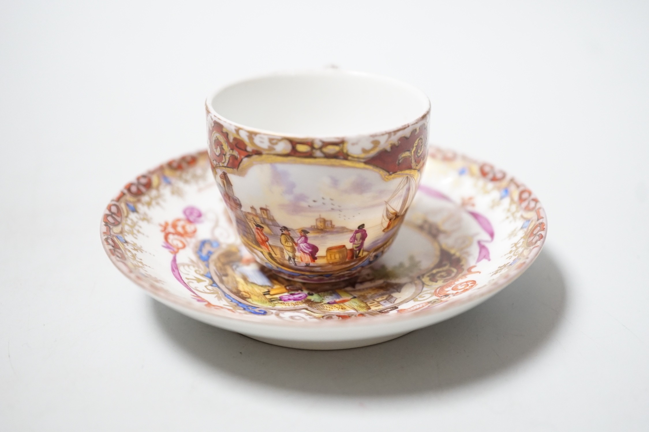 A miniature Dresden teacup and saucer in Meissen-style, cup 4.5cm